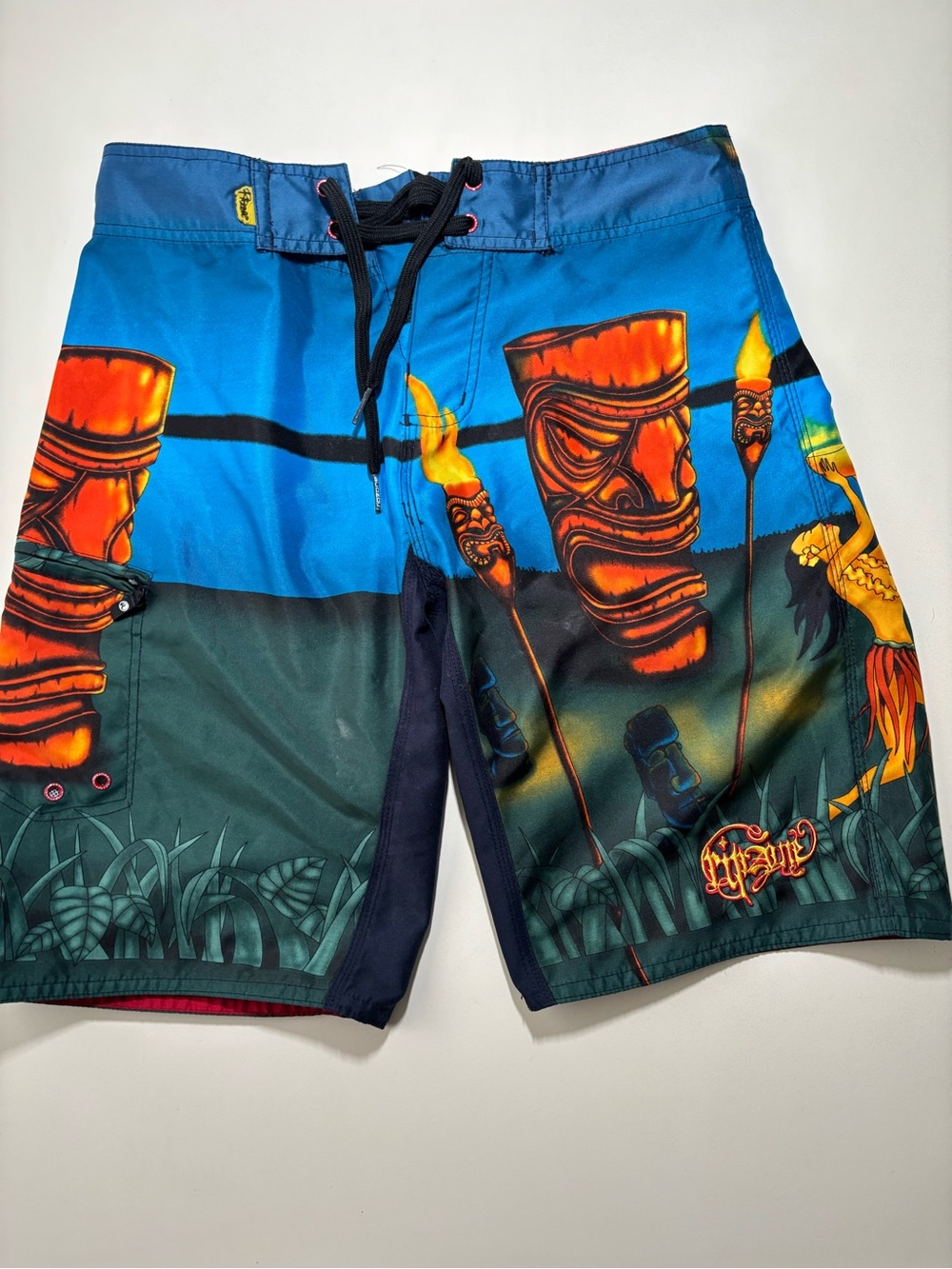 Y2k tiki palm/statue surf rip zone all over print  vintage board shorts